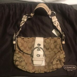 Tan and white Coach bag with braided strap